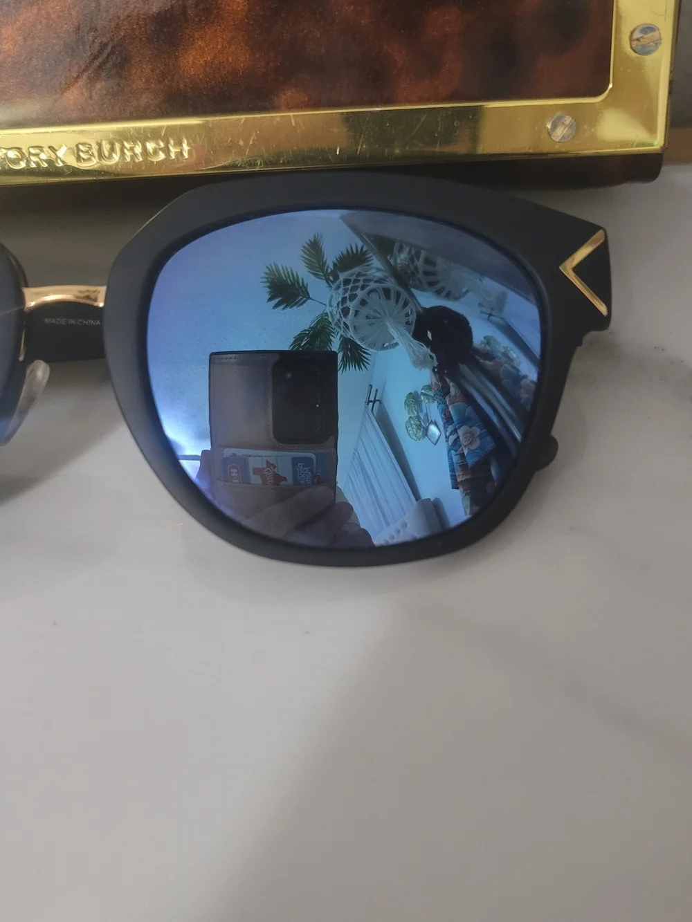 Tory Burch Black Frame Sunglasses with Blue Mirrored Lenses